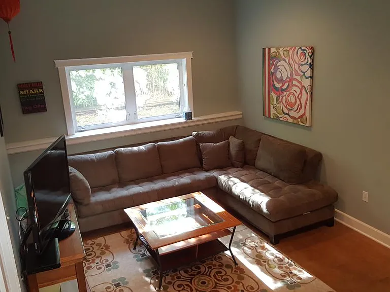 Media room (shown furnished) with 12 foot ceilings, and full size windows on lower level makes sure this space so bright. Three large bedrooms connect off the media room, making it a great space for kids and teens.