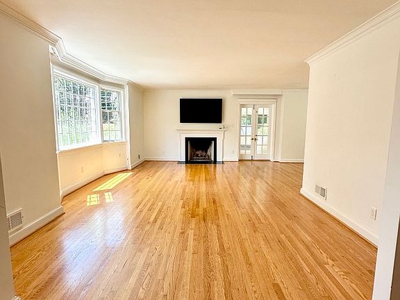 Living Room - Spacious with Natural Light and Gleaming Hardwood Floors