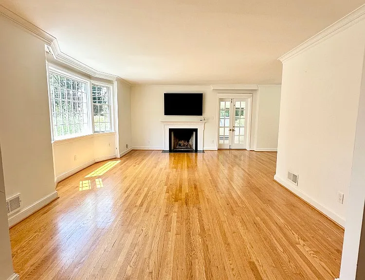 Living Room - Spacious with Natural Light and Gleaming Hardwood Floors