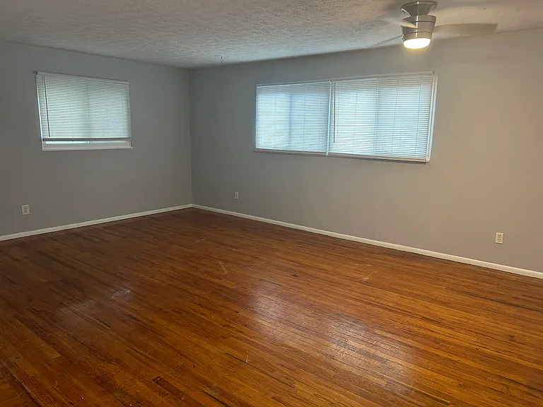Large living room with gleaming hardwood floors