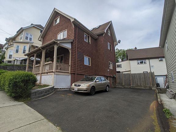 Driveway (Unit 2 gets two spots in tandem on the far edge)