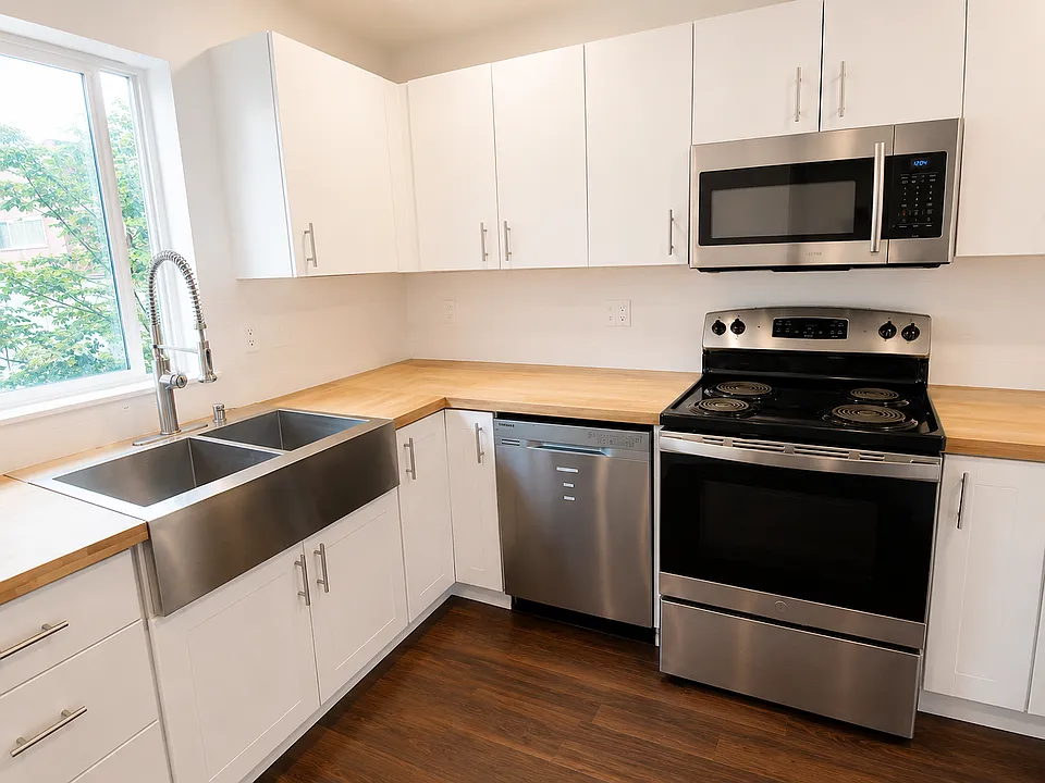 Kitchen featuring stainless-steel refrigerator, range, microwave, and dishwasher.