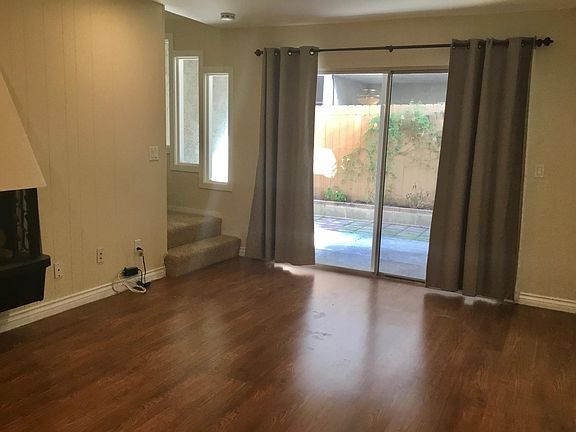 Living room opens to private patio.