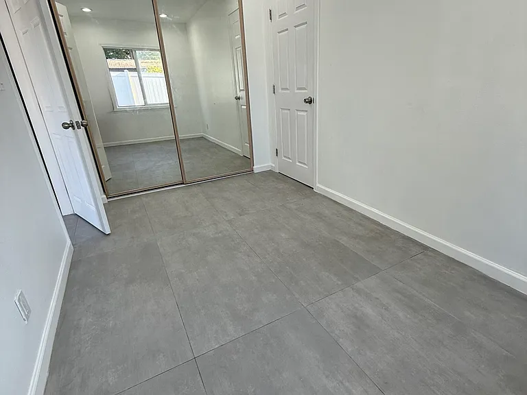 Customize this bedroom with your bed. The shelved closet is a wonderful addition to this unit. A window is located in the back of the room to provide lots of natural light.