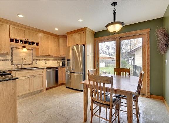 Gourmet style kitchen with custom shaker style cabinets, granite counter-tops, new stainless steel a