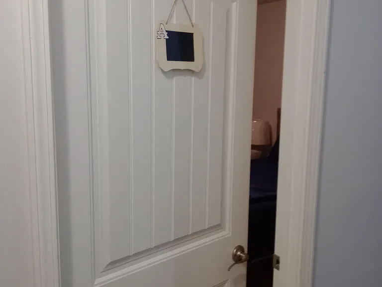 Shared bathroom w/ shower/tub and vanity, conveniently located off the hallway for everyday use.