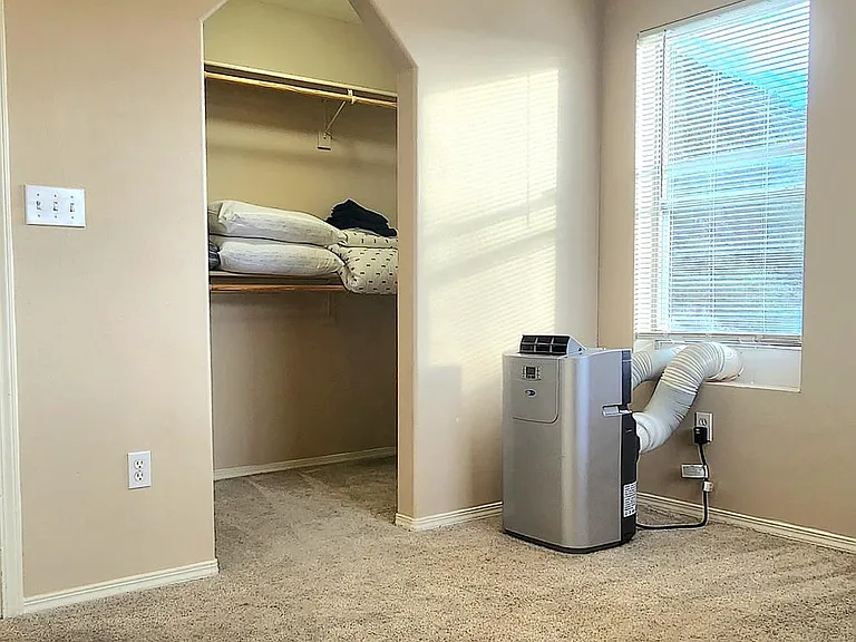 Upstairs bedroom 2 closet and portable AC