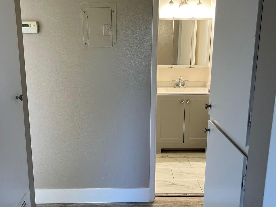 Hall Bathroom, all new fixtures, granite custom tile floors cut on site! Extra closet space, HVAC in unit for optimal heat in the winter and cool in the summer!