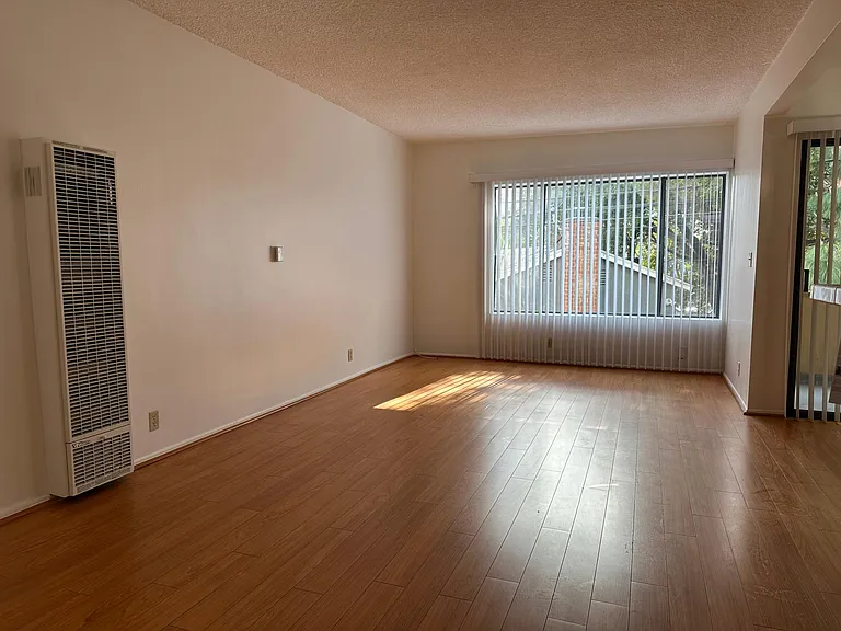 Livingroom with laminate floors and large window