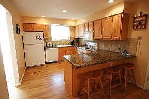 Updated kitchen with maple cabinets and granite counter tops
