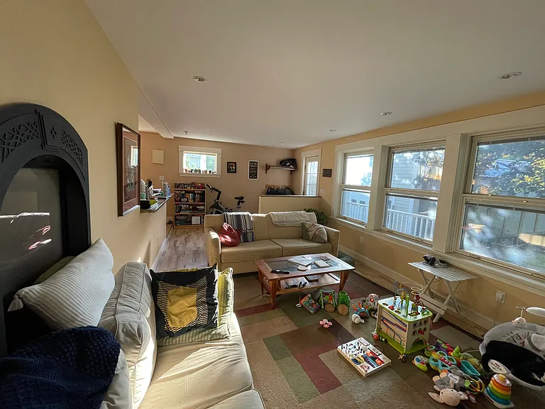 Living room with deck and backyard beyond