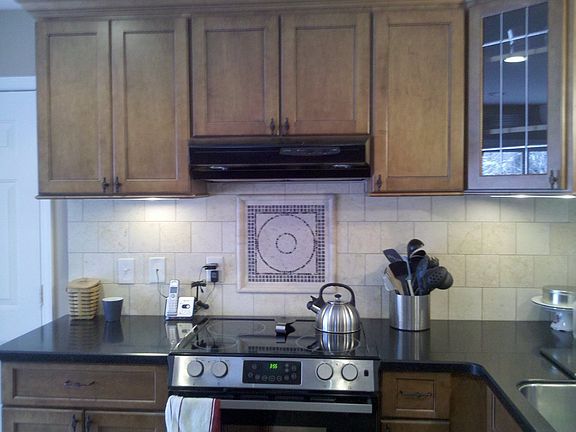 range stove with tile backsplash