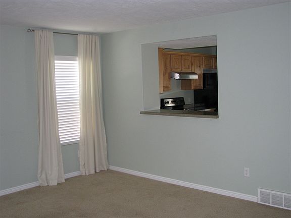 Den looking into kitchen