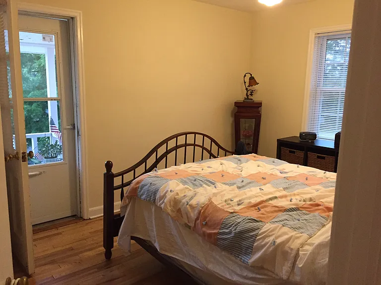 Bedroom with door to small upper porch.