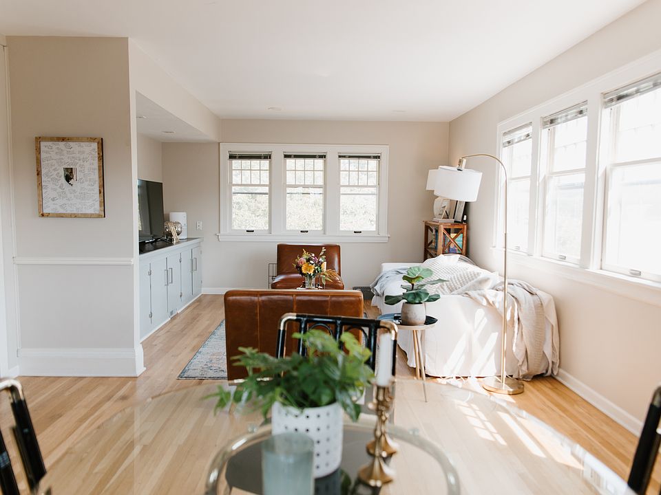 Living/dining area with built in storage cabinets/counter.