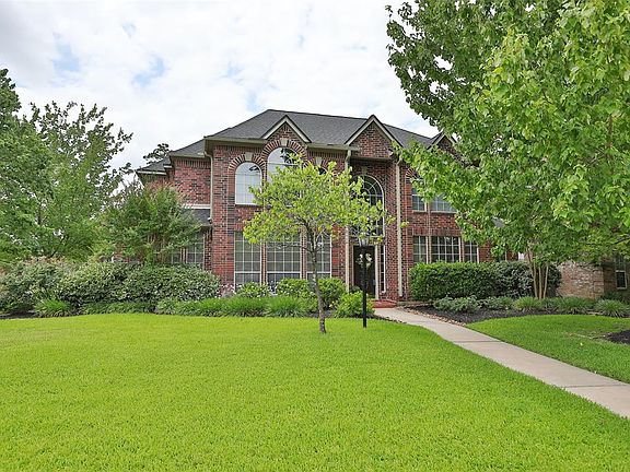 Front of home in the spring once all landscaping is in bloom! Beautiful curb appeal.