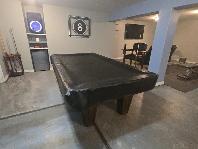 Basement: Pool table with cover