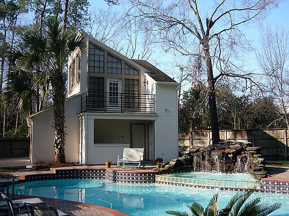 Guest quarter with full bath above second garage, pool bar and balcony overlooking large pool with w