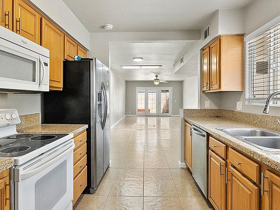 View of kitchen from laundry room/entry way
