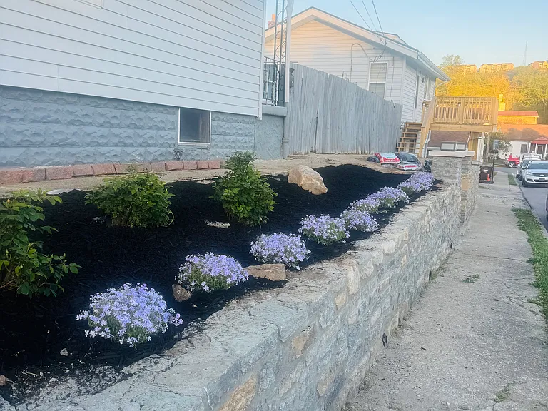 The owner takes pride and landscaping her property wonderful creepy flock was added, after the retaining wall was put in.