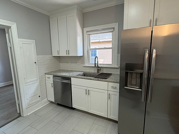 Kitchen includes custom cabinets with soft-close cabinet doors.