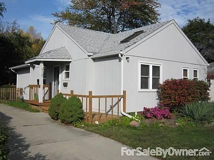 street level : New roof, gutter, front door and paint.