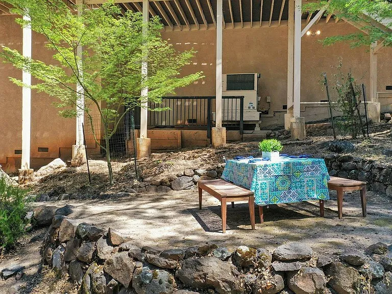 Additional outdoor teak table and benches which can be left if desired