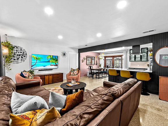 Open concept living/TV room to dining and kitchen