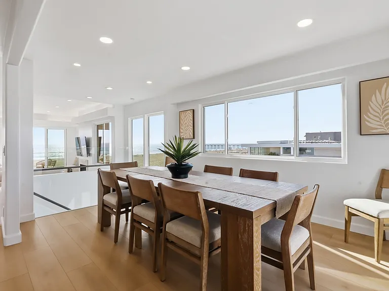 At the top of the third floor you will find a chef's kitchen with walk-in pantry, breakfast nook, 8-sit dining table, and rooftop patio with direct stair access to the street