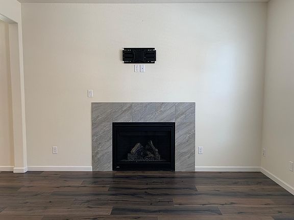 Family Room, open to kitchen & dining areas. Gas Fireplace and TV mount.