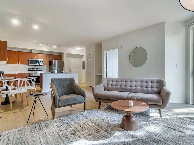 Furnished+ apartment homes come outfitted with a sofa, side chair, side table, coffee table, TV stand and 50" Television (Representative Image exact items and style of furnishings may vary)