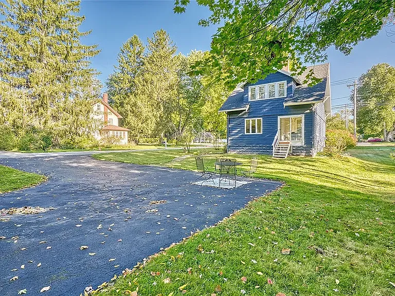 Sliding glass doors lead to a large back yard.