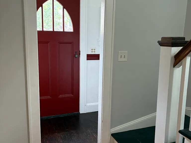 Front door entry with closet and drop zone.