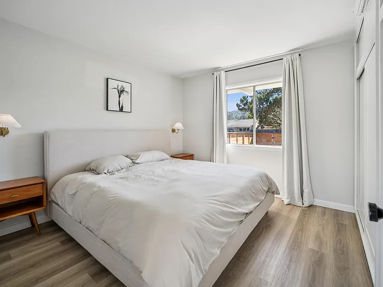 Spacious primary bedroom with large closet and peaceful natural light