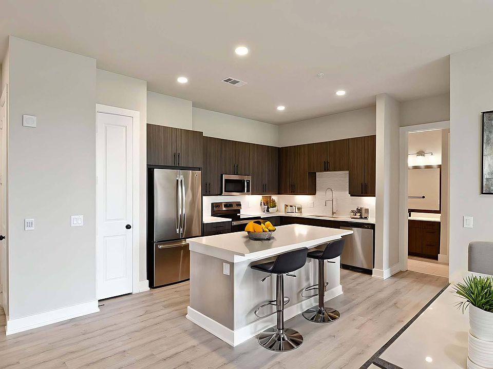 Cook and entertain with ease in a sleek, modern kitchen built for both style and function.