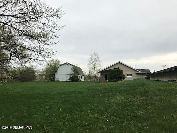 BACK OF HOUSE AND BARN