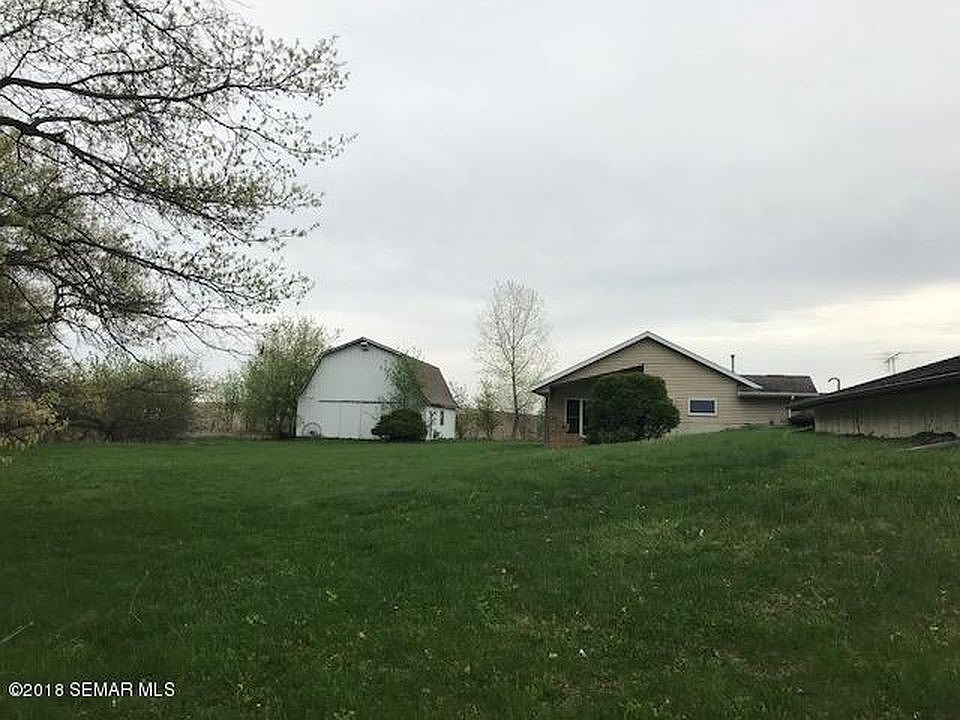 BACK OF HOUSE AND BARN
