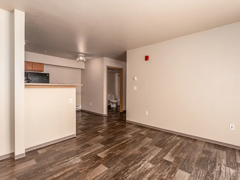 Living Room looking at dining nook & bathroom - Upper Building