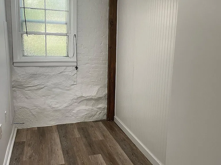 Small home office (or can be extra storage or large walk in closet-see picture next pictures with storage wall unit shown).