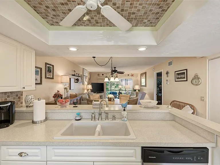 Never miss a moment! __ Our upgraded kitchen features beautiful new cabinetry and a clean, modern design that opens directly into the dining and living areas. Whether you're whipping up a quick breakfast or a full vacation feast, you can enjoy the view!