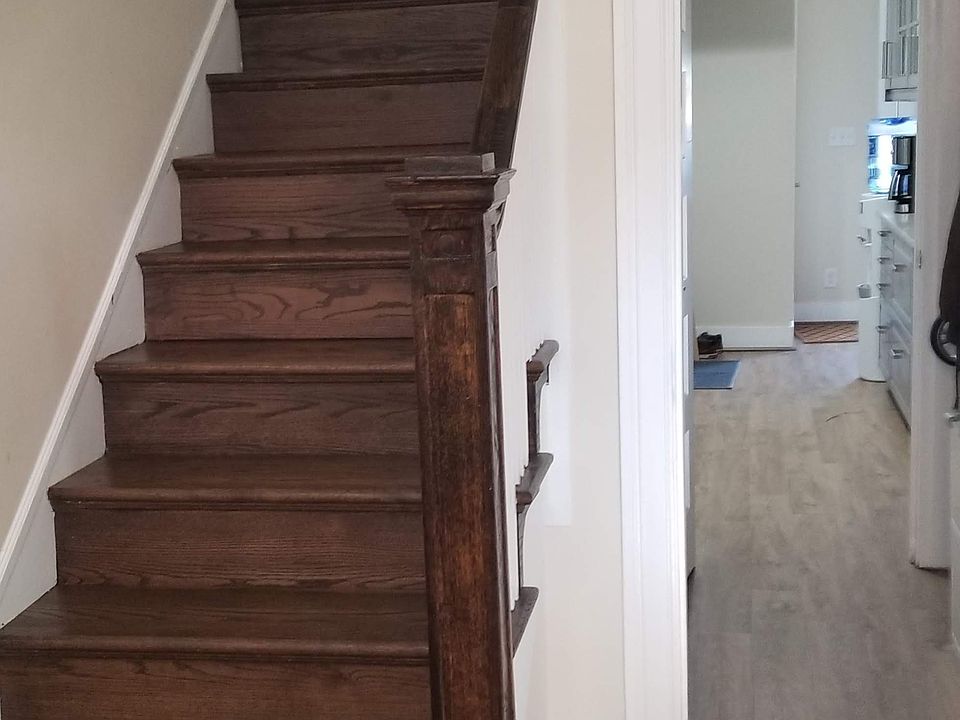 View from foyer into hall closet on right, pantry on left, through to galley kitchen