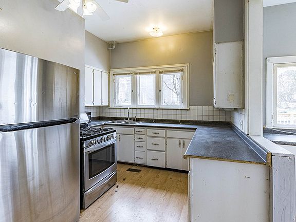 Kitchen with Stainless Steel Range & Refrigerator