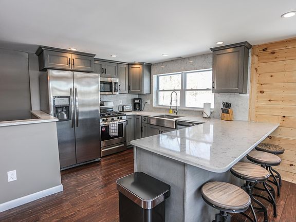 Updated kitchen with quartz counter tops & SS appliances
