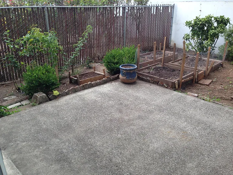 Patio & garden area in fully fenced backyard