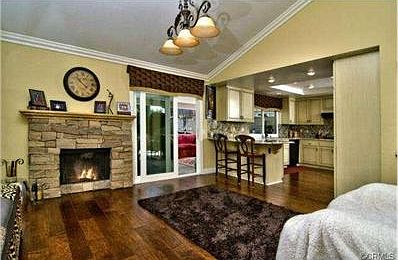 Family room off of kitchen. Fireplace mantle is hand-painted