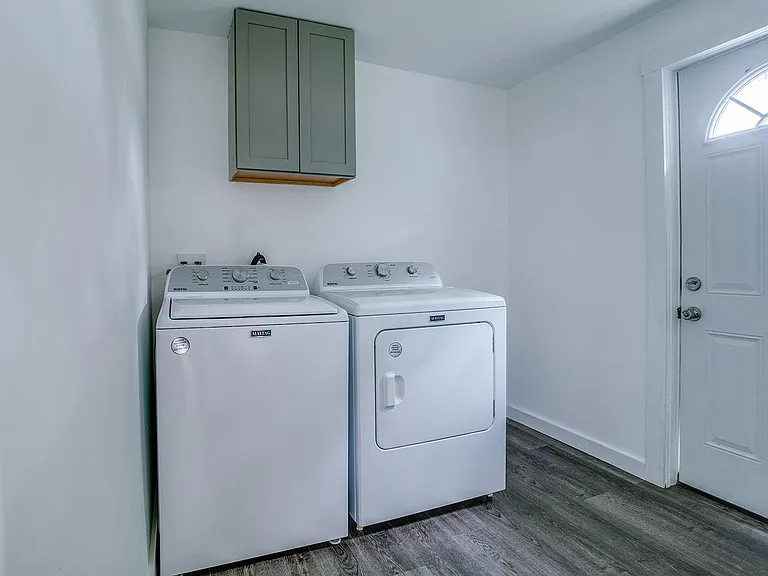 Utility room and exterior door. New appliances