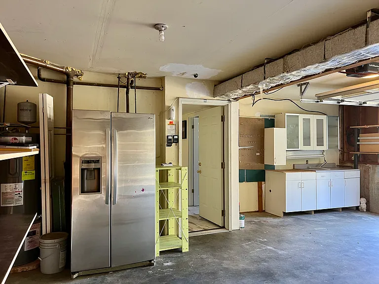 An extra refrigerator in the garage