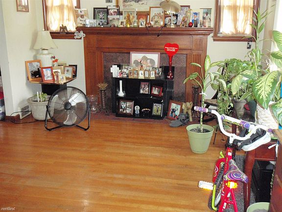 Huge Living Room with natural fireplace and wood floors.