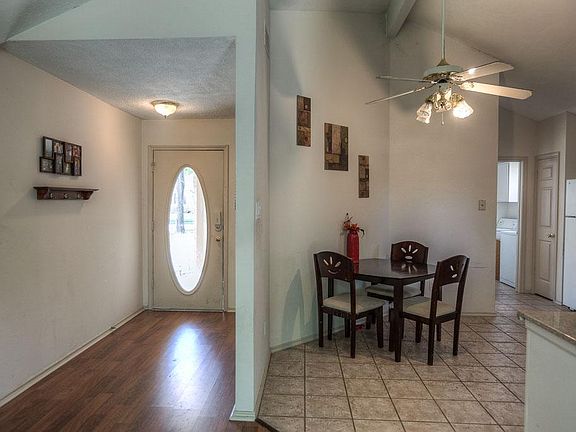 Beautiful entry has wood laminate flooring.