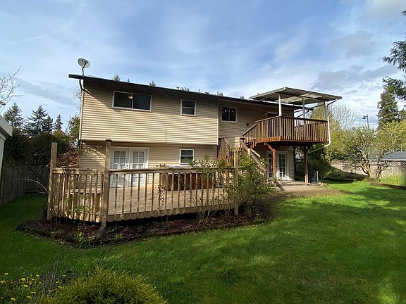 Backyard view of home and patio